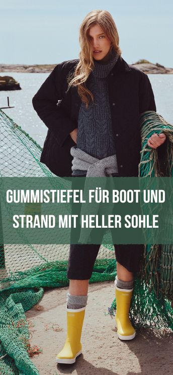 Bootsstiefel von Viking Frau im Hafen mit Fischernetz und gelbem Seilas Gummistiefel